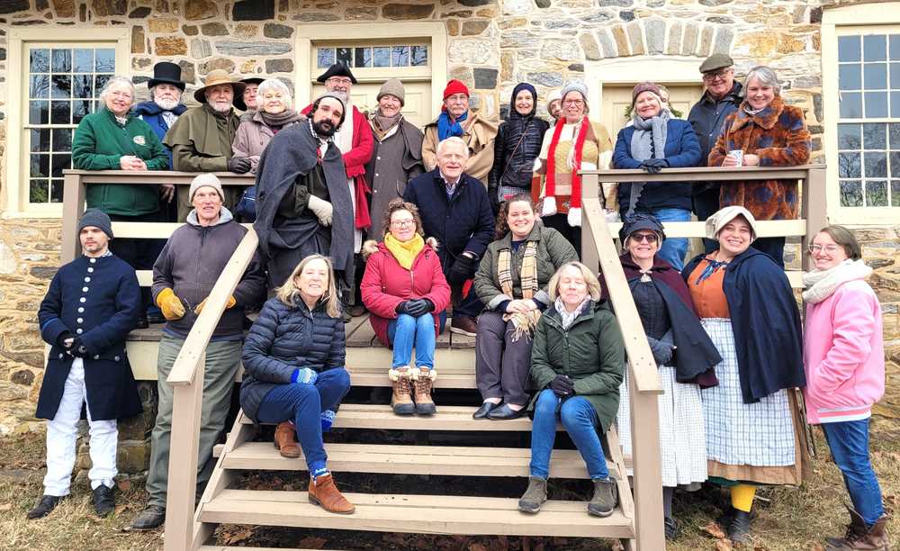 The Farmstead volunteers gathered on the farmhouse steps.